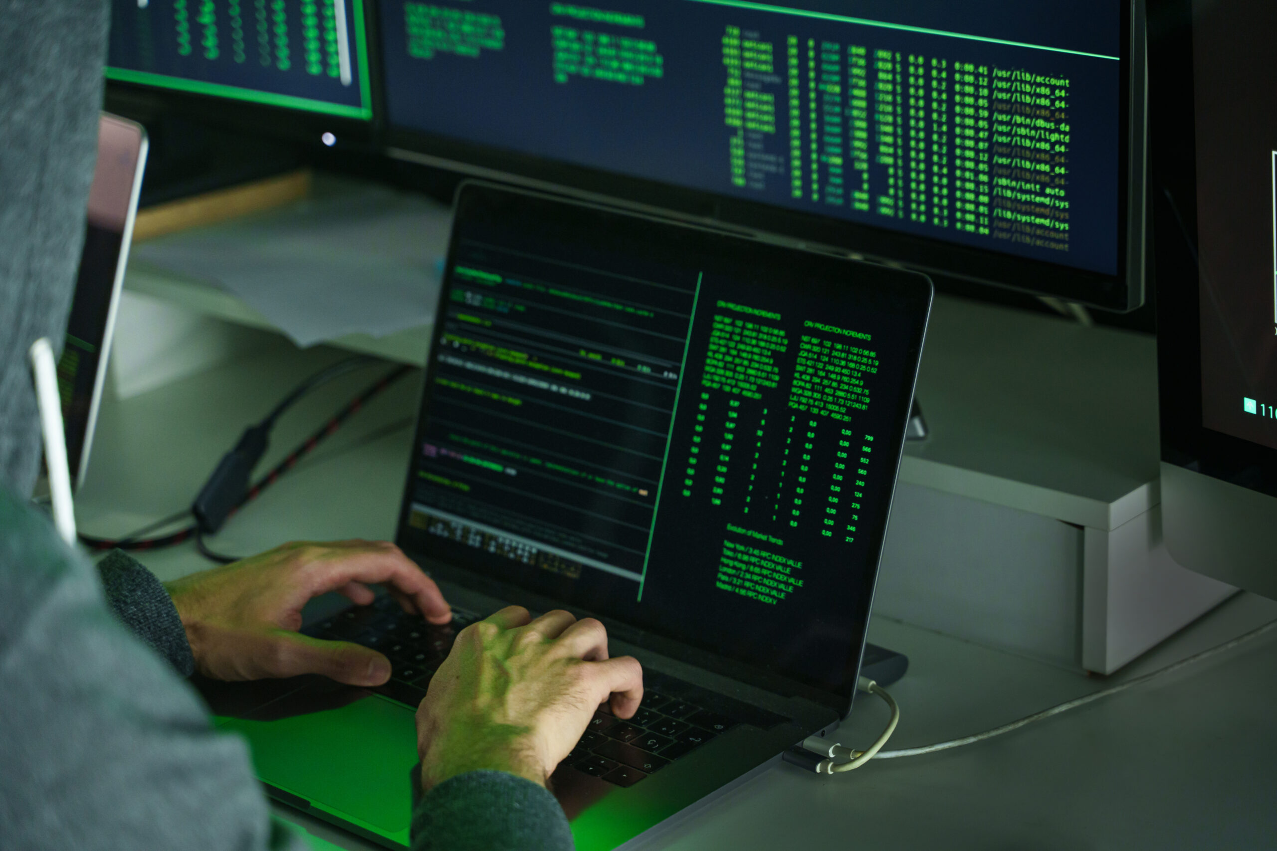 Hacker hands using laptop computer to code
